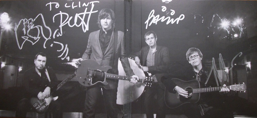 The Old 97's The Grand Theater Vol. 1 cd inside spread autographed by (from left to right) Ken Bethea, Rhett Miller, Philip Peeples and Murray Hammond.