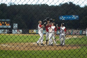 Kris Koerper and teammates celebrate after Koerper's 3-run home run